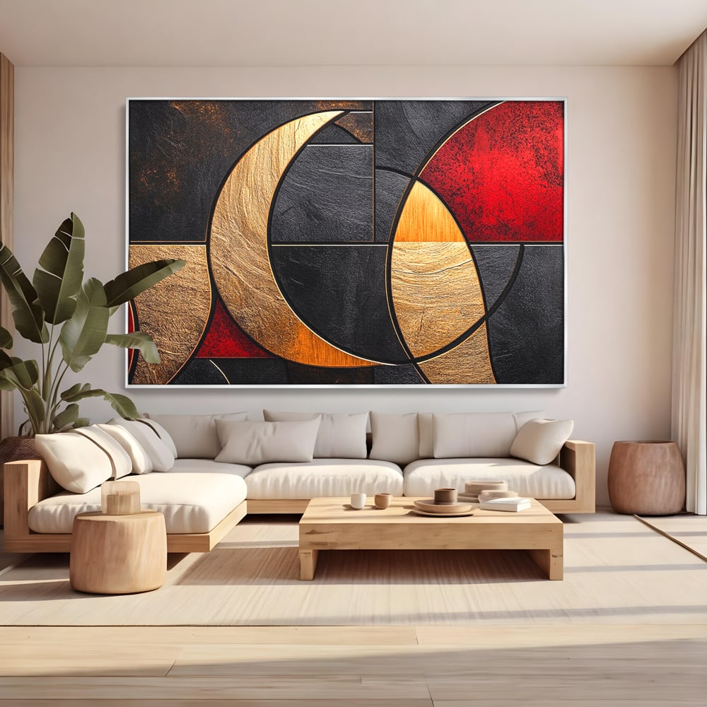 Tablou canvas cu tablou canvas cu forme geometrice aurii si rosii, in rama de aluminiu argintiu, pe perete intr-un living